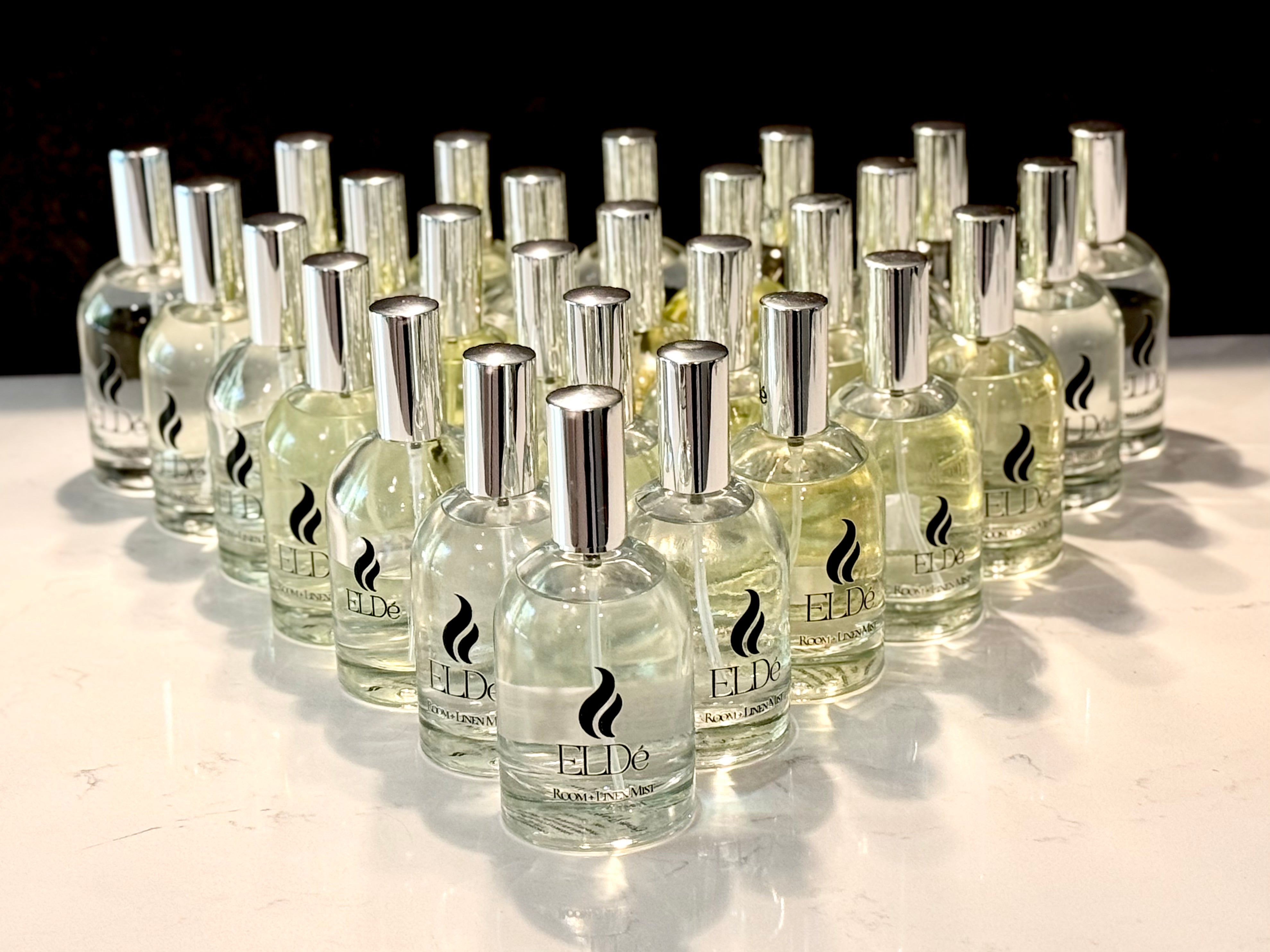 Multiple bottles of a product with a brand logo on a reflective surface.