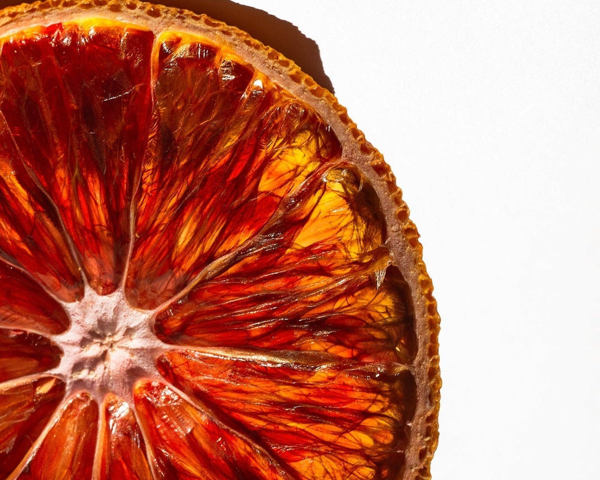 Close-up of a dried orange slice on a white background