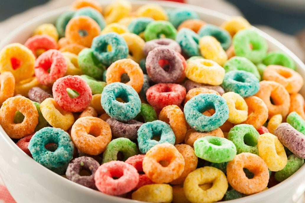 Bowl of fruity rings cereal representing Hexaglow Whimsical Morning Bliss candle scent