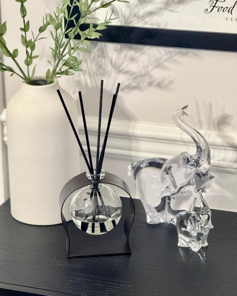 Radiance Reed Diffuser - Amalfi Neroli Breeze, detailed close-up of glass bottle and reeds