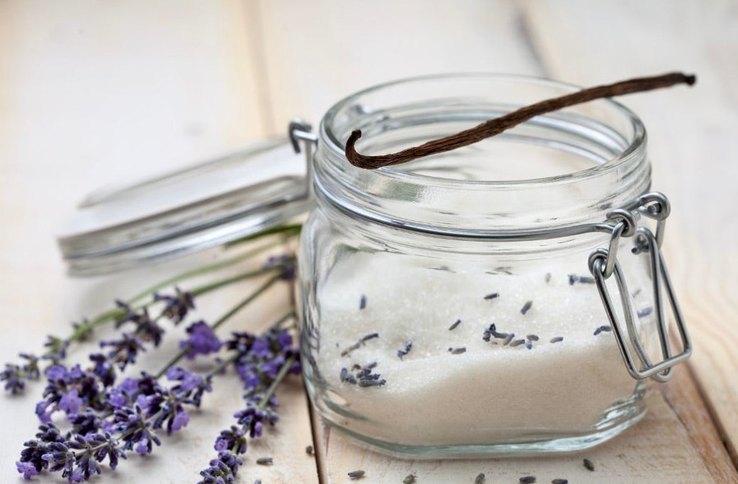 Jar of sugar with sprigs of lavender and a vanilla bean representing Silverscape Lavender and Vanilla Bliss candle scent