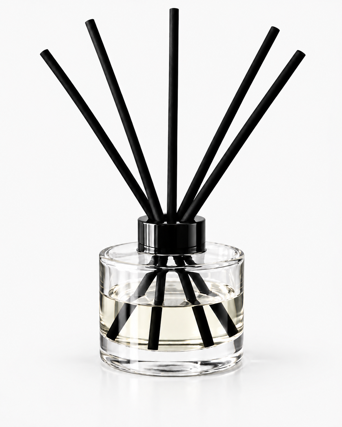 Clear glass Eclipse reed diffuser with black collar and five black reeds, filled with fragrance oil against a clean light background.