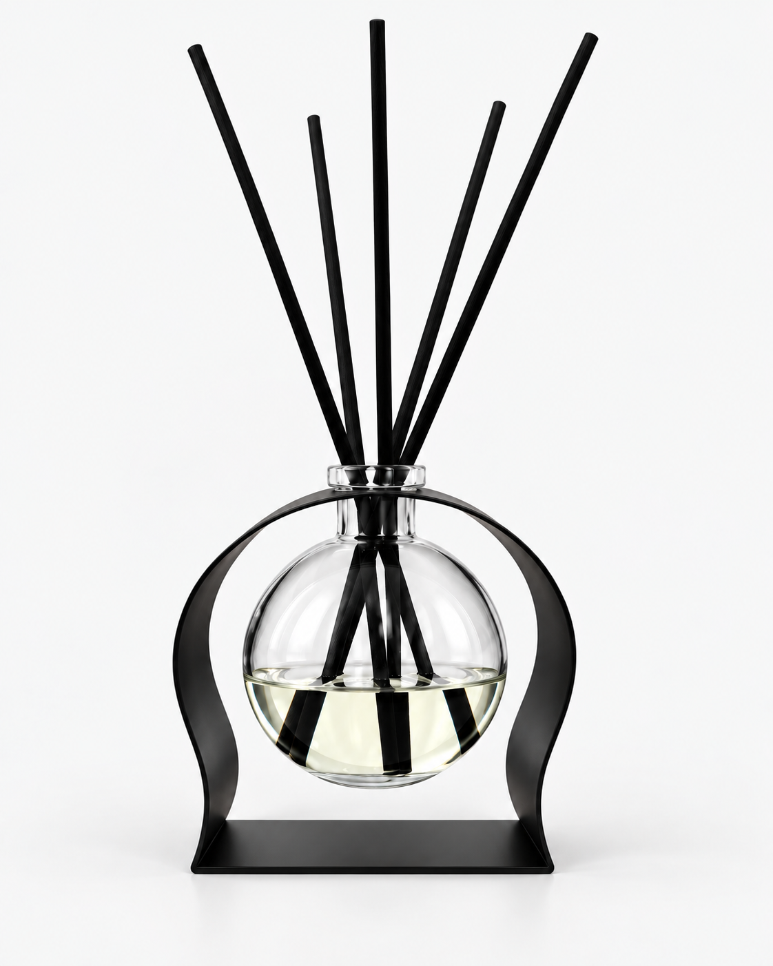 Clear glass Radiance reed diffuser with five black reeds, displayed in a sculptural black metal stand against a clean light background.