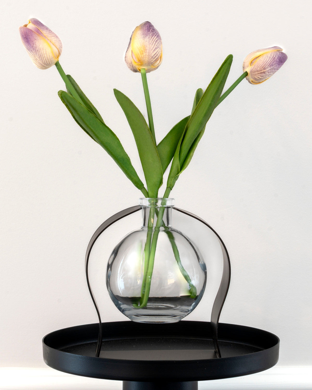 Radiance Reed Diffuser holding tulips