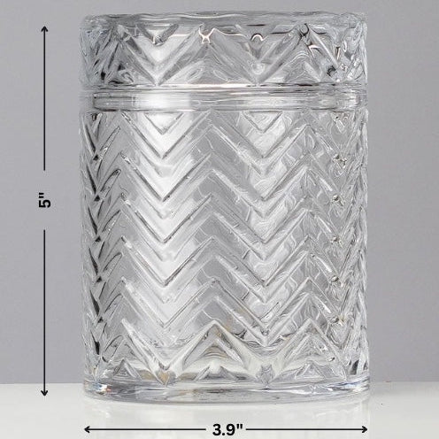 Clear glass tumbler with zigzag pattern and measurements on a gray background