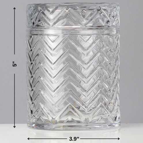 Clear glass tumbler with zigzag pattern and measurements on a gray background