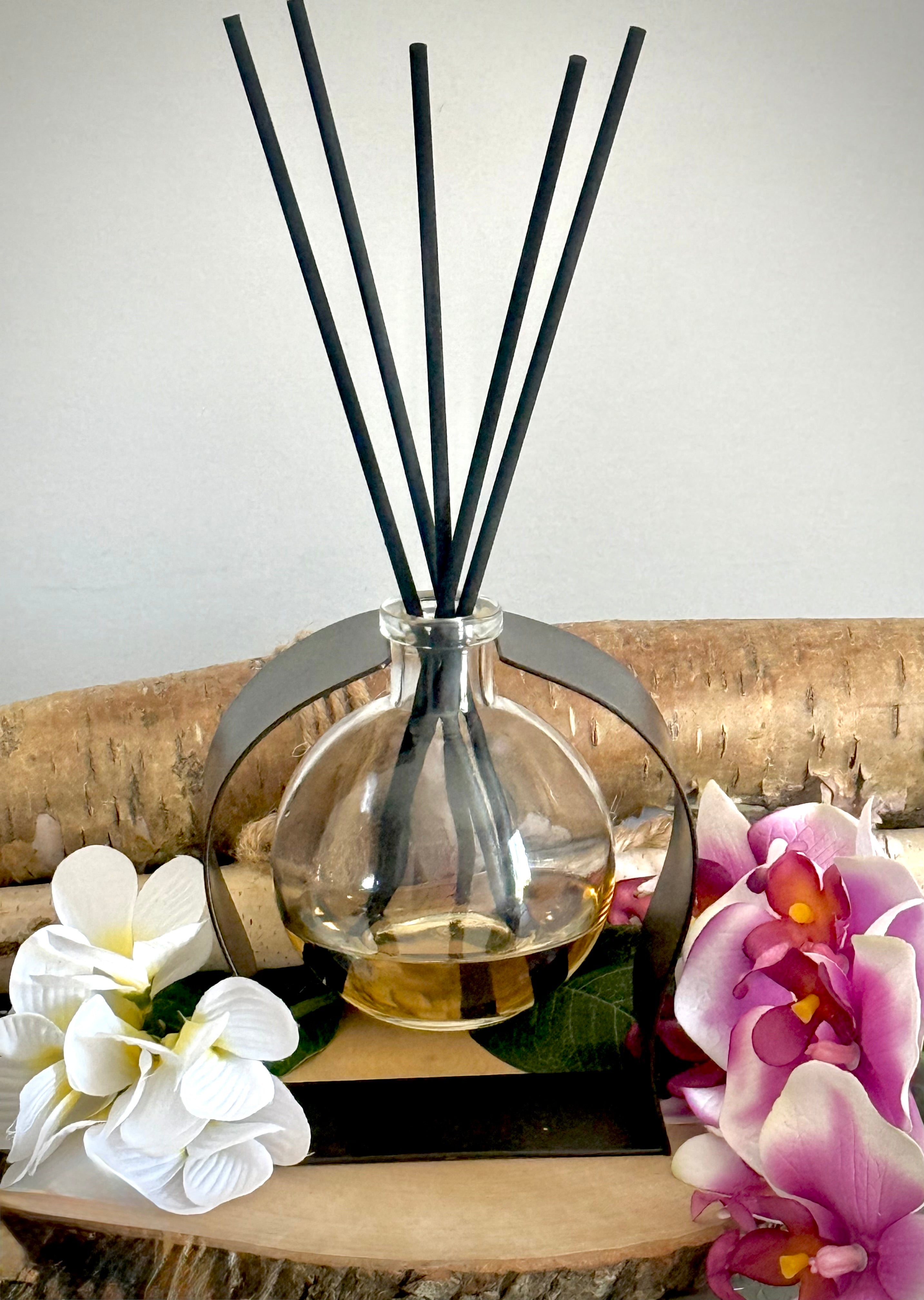 Radiance Reed Diffuser - Coastal Essence front view, sleek glass design