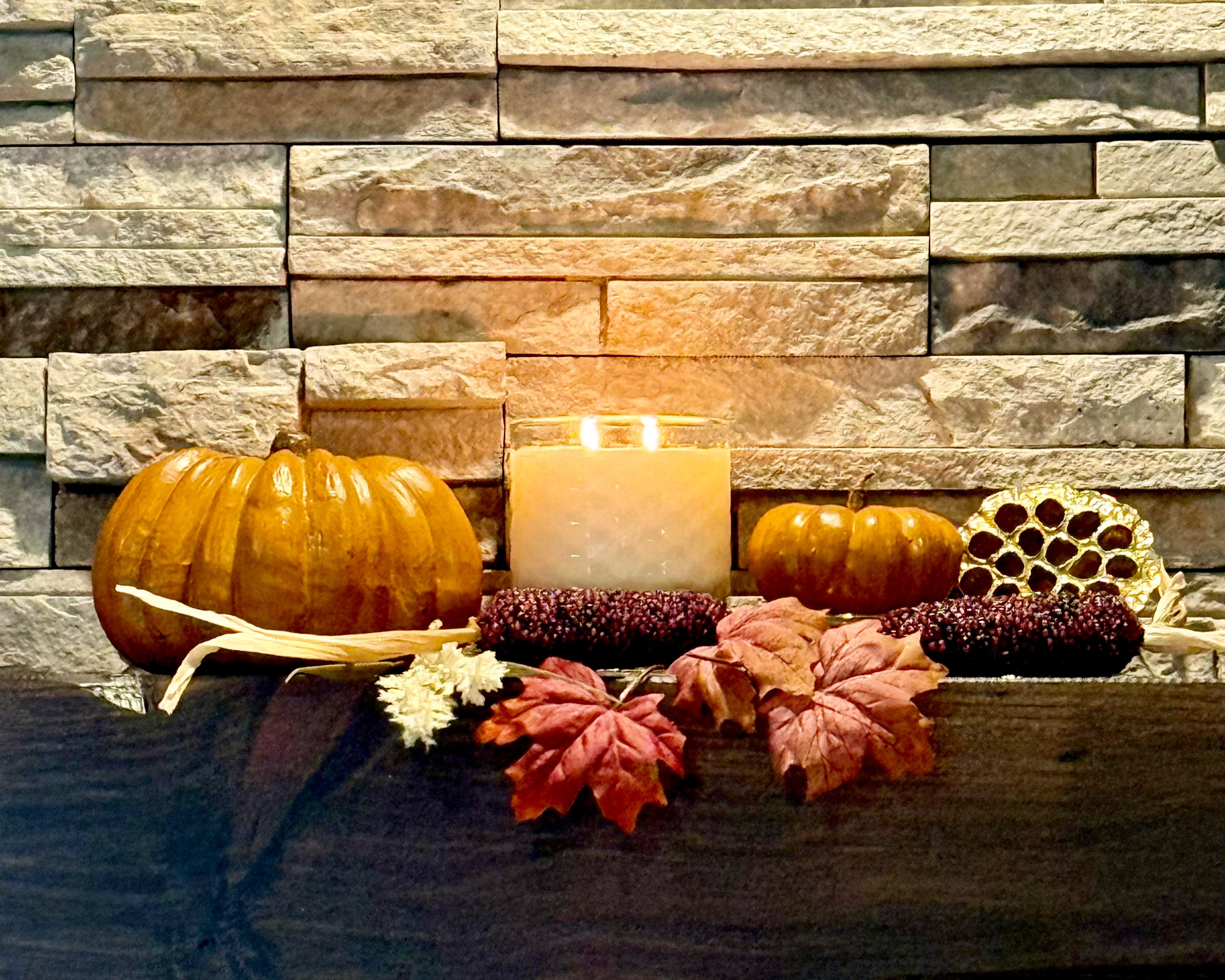 Pumpkin Reverie Candle glowing with cozy pumpkin spice scent