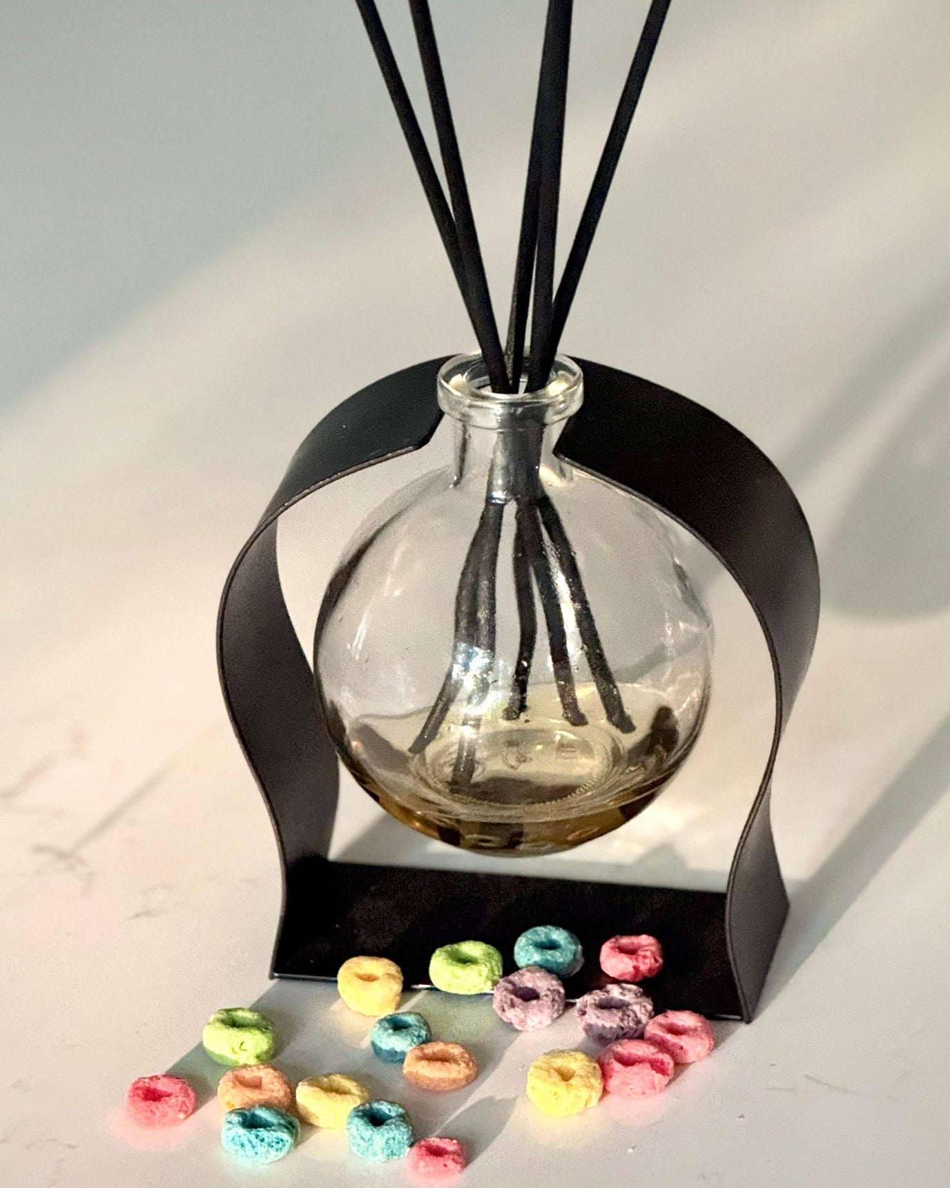 Radiance Reed Diffuser - Whimsical Morning Bliss front view, sleek glass design
